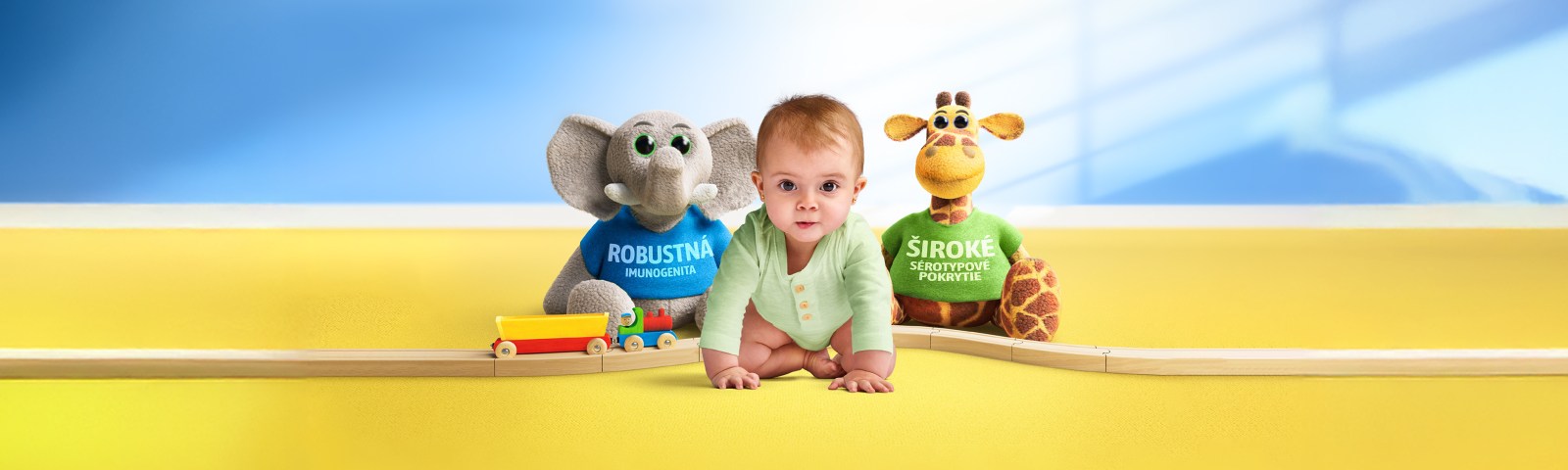 Baby with elephant and giraffe toys